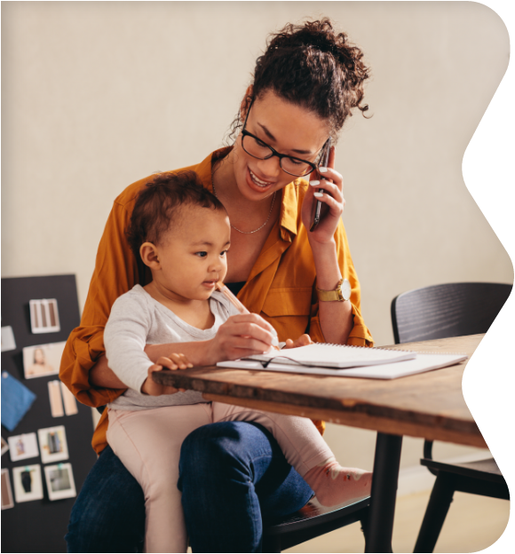 Parent holding child while on the phone